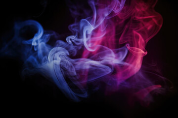 Obraz premium Dramatic smoke and fog in contrasting vivid red, blue, and purple colors. Vivid and intense abstract background or wallpaper. 