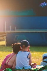 Children watch cartoons in the summer cinema.