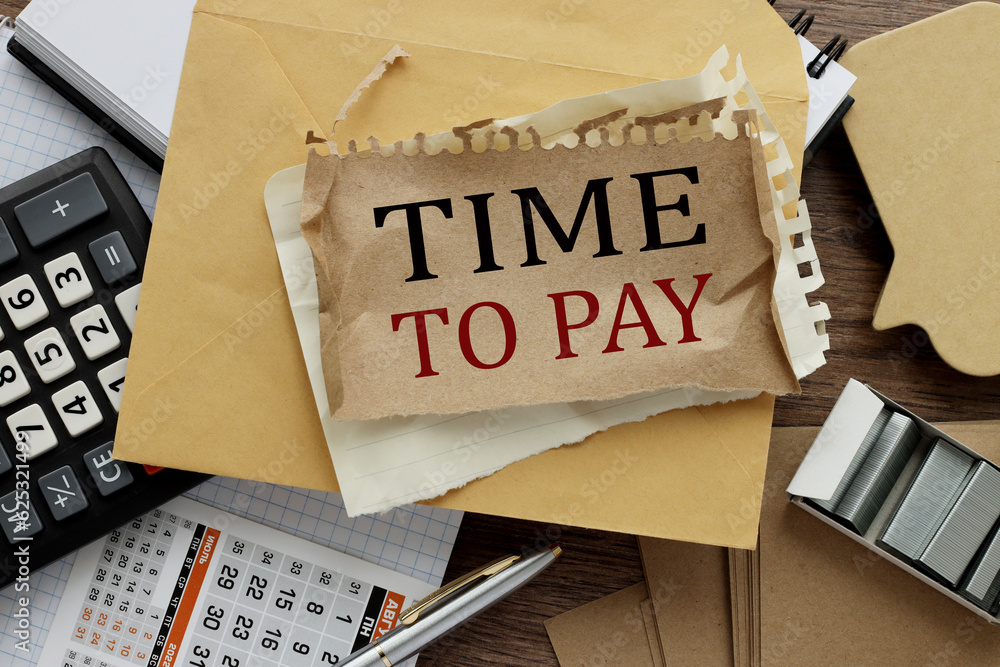 Poster Notebook with text Time To Pay on table with pen