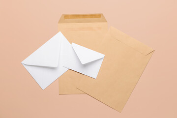 Set of paper envelopes on color background