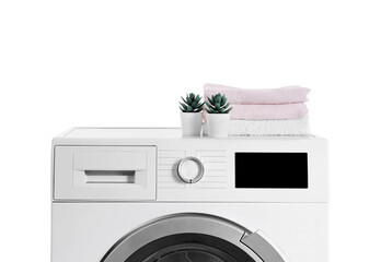 Washing machine with folded towels and houseplants isolated on white background