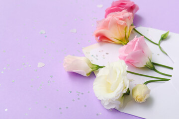 Blank envelope with beautiful eustoma flowers and confetti on purple background, closeup