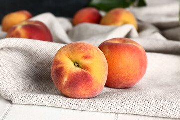 Sweet peaches on white tile table