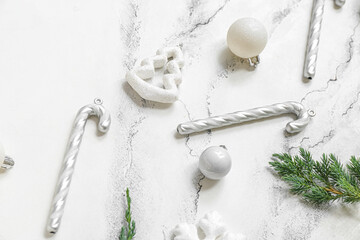 Different Christmas decorations on white marble background