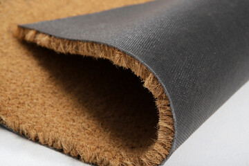 Natural brown coconut fiber doormat. Plain natural dry carpet and dirt outside your entrance,...