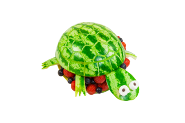 Turtle carved from a watermelon isolated on transparent or white background. Concept for kids to set for healthy eating. Suitable for children's birthday parties.