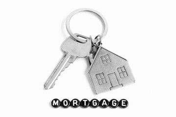 Mortgage, Silver House Key Ring On White Background