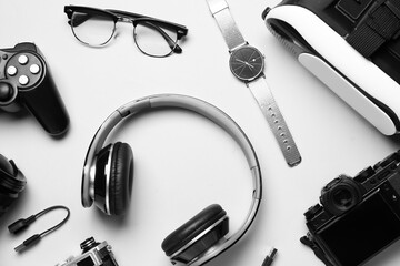 Set of different devices with eyeglasses on white background