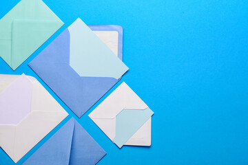 Set of envelopes with blank cards on color background