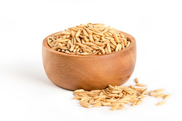 Paddy rice in wooden bowl on white background.