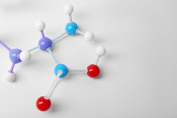 Molecule of phenylalanine on white background, closeup. Chemical model
