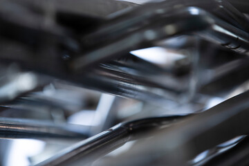 Close up shot of metal pipes in a factory, shallow depth of field