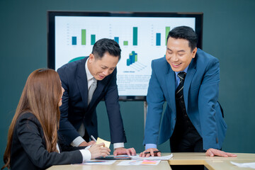 Office Conference Business Meeting Presentation: asian Business people group meeting Talks, Uses Wall TV to Show Company Growth with Big Data Analysis, Graphs, Charts, Infographics, e-Commerce Startup