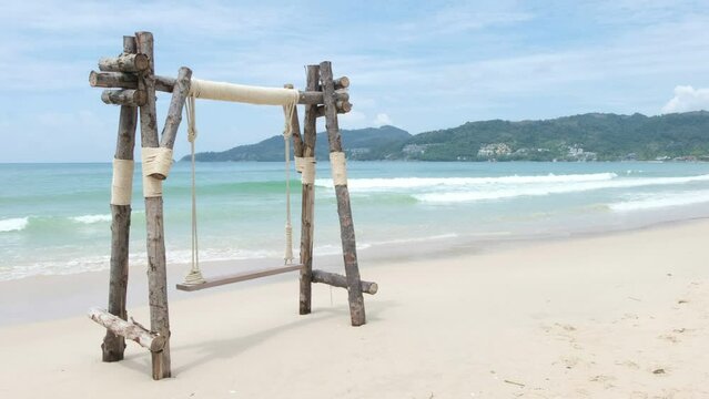 Wooden swing on the beach in phuket