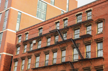 Fire escape building, A symbol of urban life's challenges and resilience. Escape routes, freedom, and safety amidst city's chaos