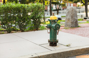 Vibrant urban symbol, fire hydrant on street embodies safety, readiness, and civic protection in...