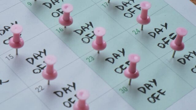 4 day work week printed calendar with pink pins on three days off in week weekend days four day working week concept. Modern approach doing business short workweek. Effectiveness of employees