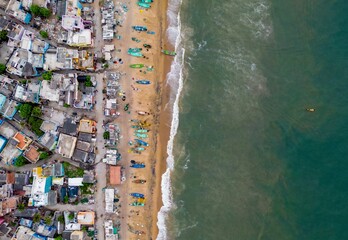 This aerial photo depicts the captivating union of boats and the seashore. The azure waters merge...
