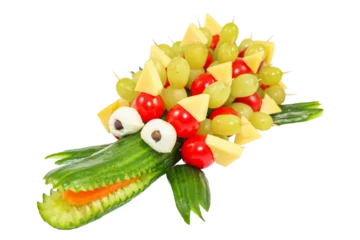 Foto auf Acrylglas Cucumber crocodile - Crocodile carved out of a cucumber isolated on transparent or white background. Concept for kids to set for healthy eating. Suitable for children's birthday parties. © zaschnaus