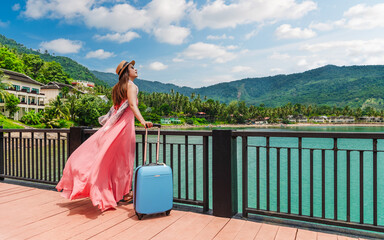 Happy traveler woman in pink dress with suitcase joy nature scenic landscape island beach in blue sky, Leisure tourist travel Thailand summer holiday vacation trip, Tourism beautiful destination Asia