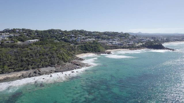 Lush Pristine Shoreline Of The Bays Of Coolum On Sunshine Coast In Queensland, Australia. aerial pullback