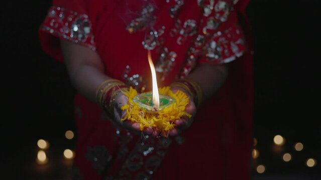 Clay diya lamps lit during diwali celebration, Diwali, or Deepavali, is India's biggest and most important holiday.