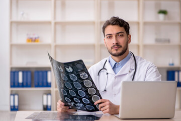 Young male doctor radiologist working in the clinic