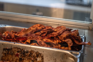 A close up of cooked bacon wating to be served
