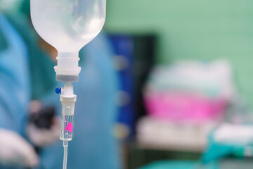 Normal saline solution or sodium chloride with infusion bottle drip for patient in hospital,...