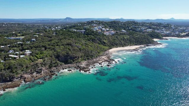 Coastal Haven In The Bays Of Coolum In Queensland, Australia. aerial sideways