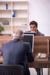 Two male colleagues working in the office