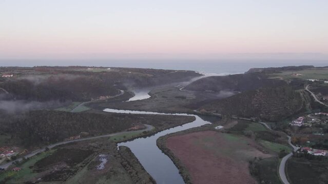 Flying over the seixa river towards praia de Odeceixe in the morning, aerial