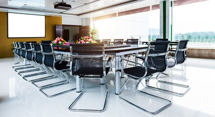 Empty conference table and chairs in meeting room