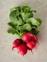 Fresh radish lies on a wooden board. Diet food. Fresh vegetables for making vitamin salad.         ...