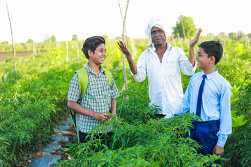 Obraz premium Indian three people standing in farm