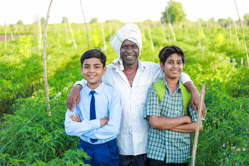 Indian three people standing in farm