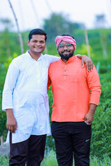 two indian farmer standing in farm