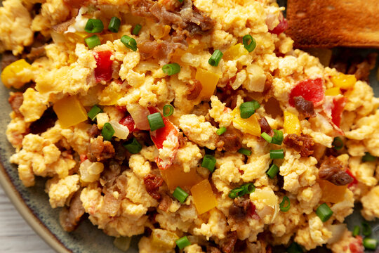 Homemade Fiesta Scrambled Eggs With Peppers And Toast On A Plate, Top View. Flat Lay, Overhead, From Above. Close-up.