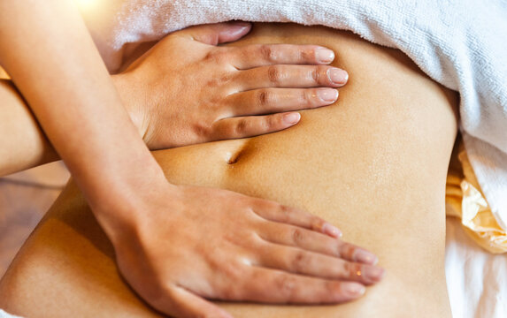 Woman receiving professional belly massage