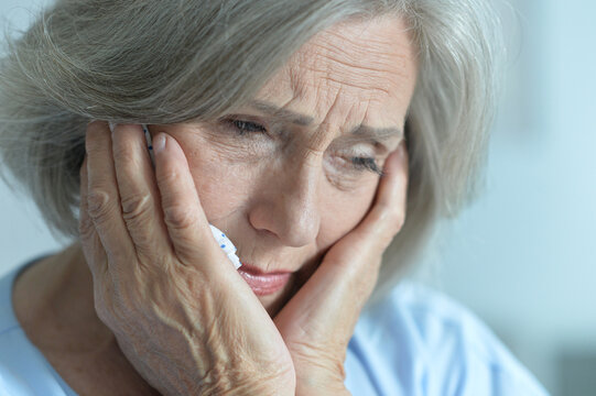 Close Up Portrait Of Sick Old Woman