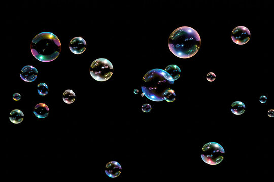 Soap bubbles floating on a black background, Generative AI