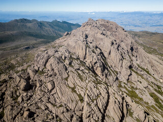 Beautiful aerial view to rocky mountain and altitude fields