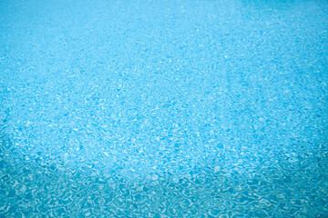 Reflections in the water ripple in the hot sunlight.