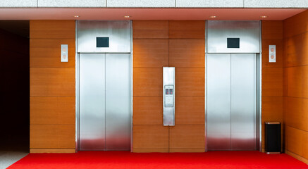 Two elevator doors in luxurious building © xy