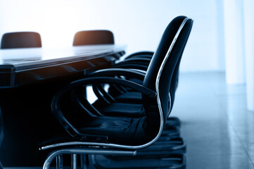 Conference table and chairs in empty meeting room