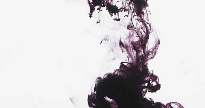 Slow motion video of purple watercolor ink mixing in water against grey background