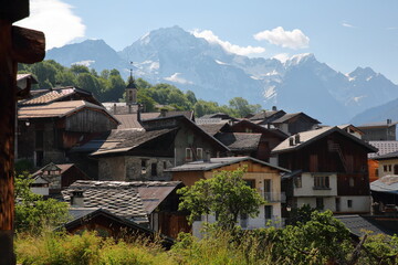 The hamlet of Villemartin, located above the commune Bozel, Northern French Alps, Tarentaise, Savoie, France, with the Grand Bec summit in the background