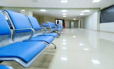 Hospital waiting room with row of empty chairs