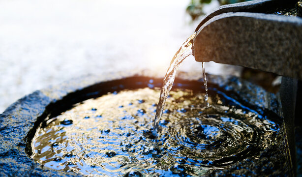 Traditional spring water fountain in garden