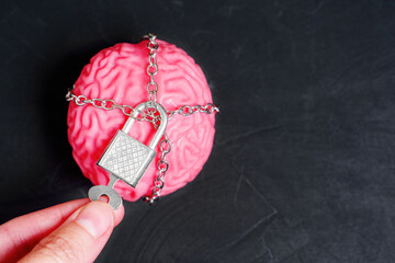 Hand Unlocking a Padlock that Restrains the Human Brain